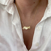 Model wearing personalized copper necklace with heart charm